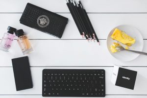 Stylish workspace with stationery and snacks.
